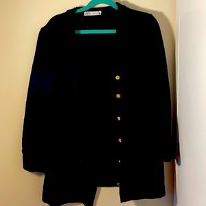 Black Zara cardigan with beautiful gold hardware. Very stiff, not Stretch.